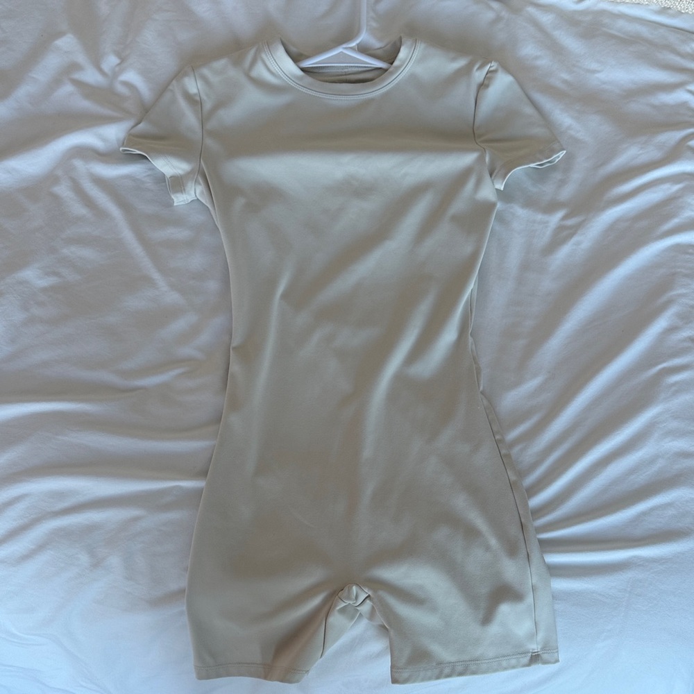 Women's Cream Short-Sleeve Footie Bodysuit